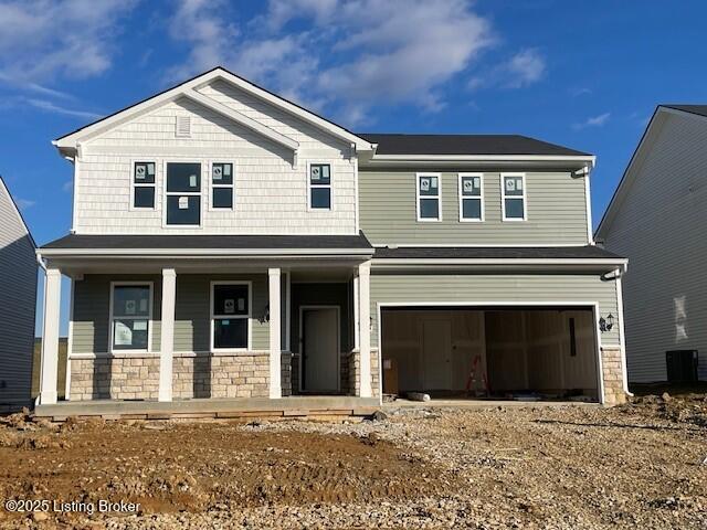 craftsman house featuring a porch and a garage