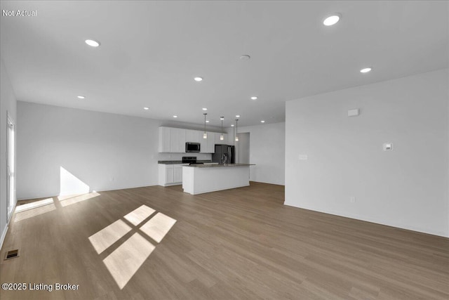 unfurnished living room with light hardwood / wood-style flooring