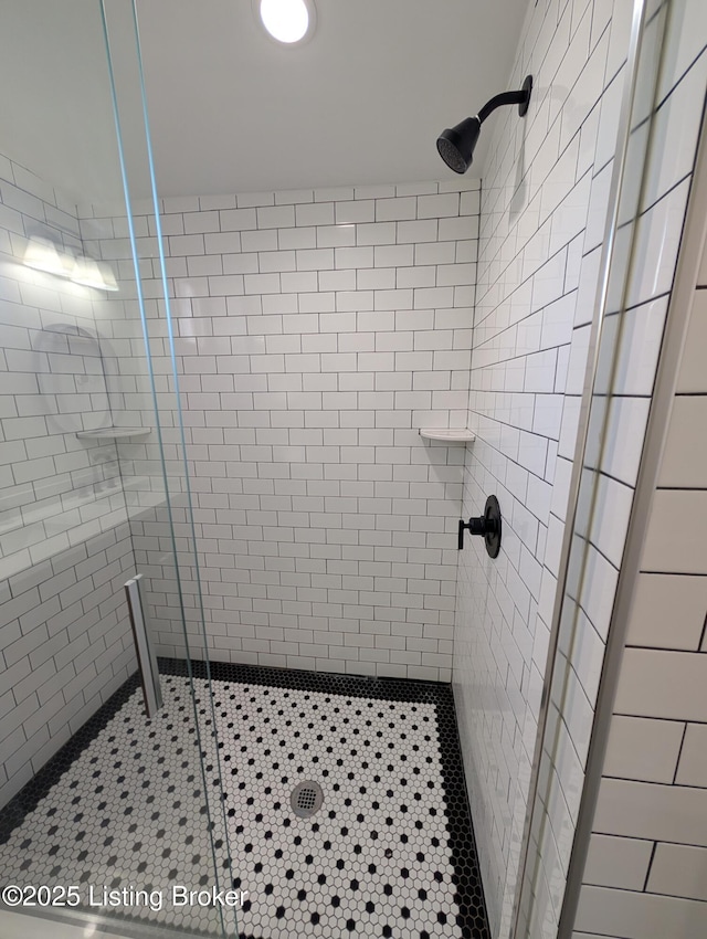 bathroom with a shower with shower door