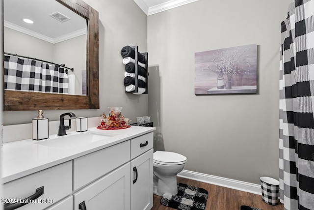 bathroom with toilet, wood-type flooring, vanity, and ornamental molding