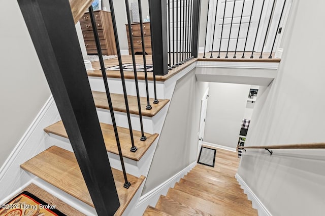 stairway with wood-type flooring