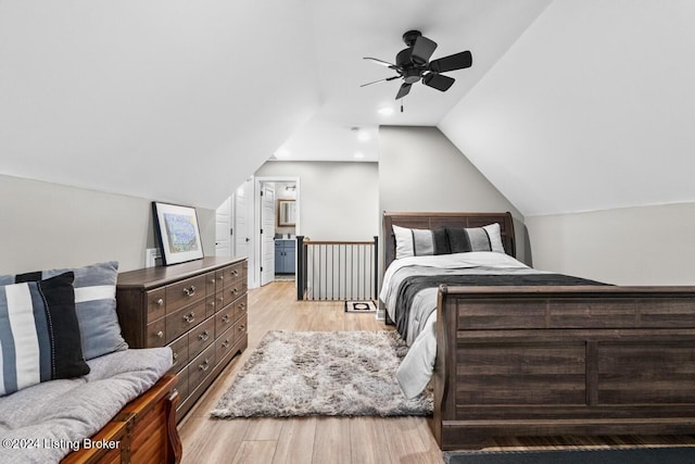 bedroom featuring vaulted ceiling, ceiling fan, and light hardwood / wood-style flooring