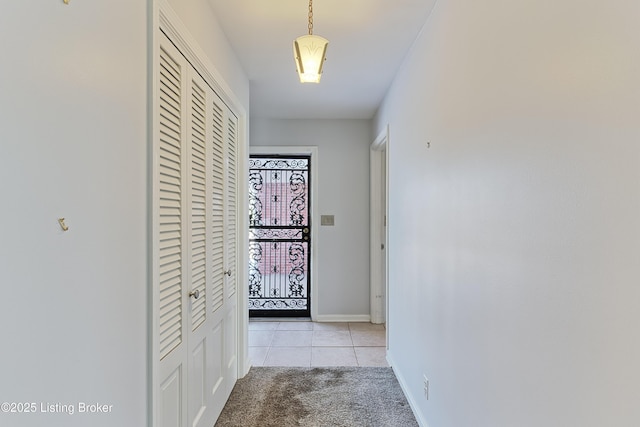 hallway featuring light tile patterned floors