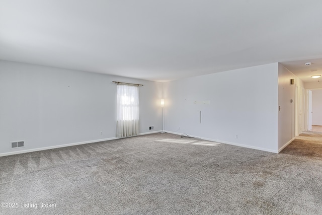 unfurnished room with light carpet