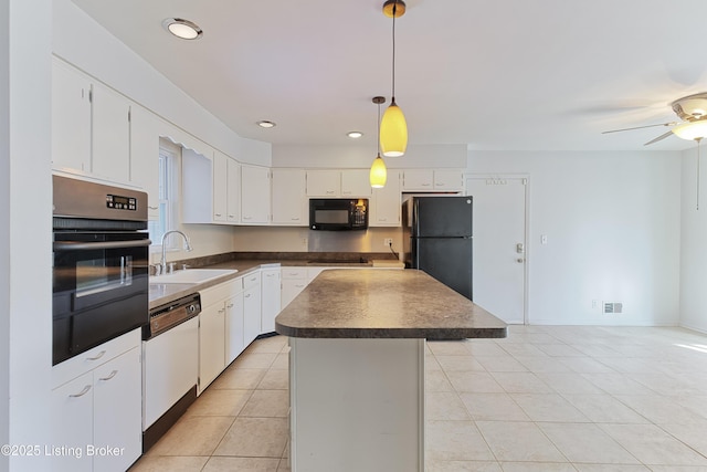 kitchen featuring sink, white cabinets, black appliances, and a kitchen island