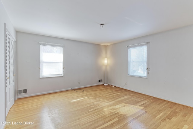 unfurnished room featuring light hardwood / wood-style floors