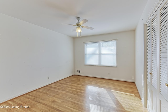 unfurnished bedroom with light wood-type flooring and ceiling fan