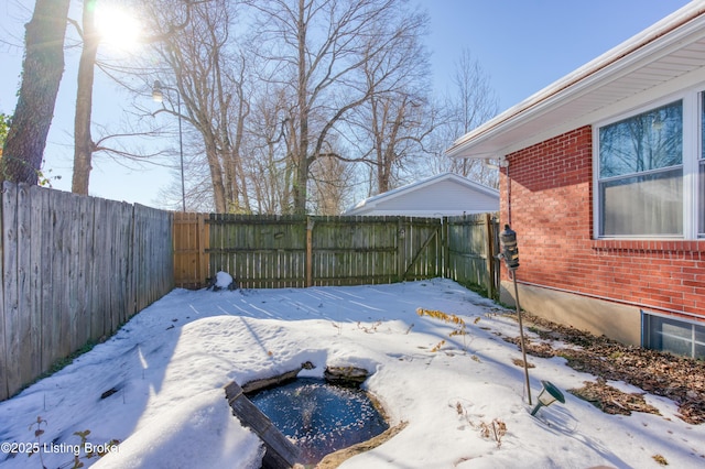 view of yard layered in snow