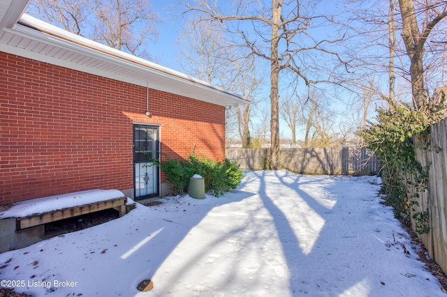 view of yard layered in snow