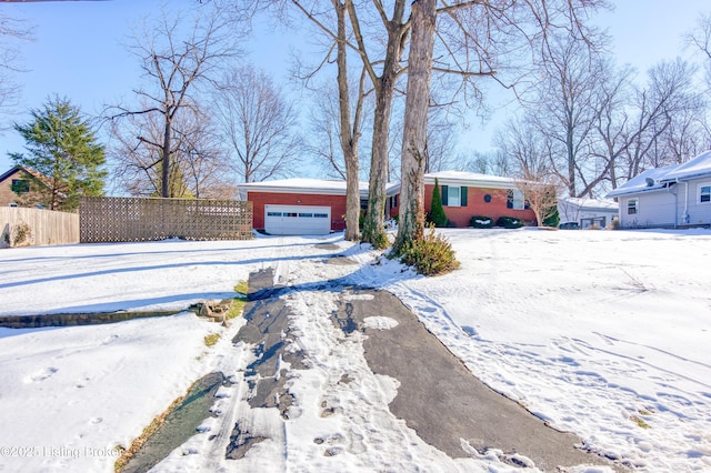 single story home featuring a garage