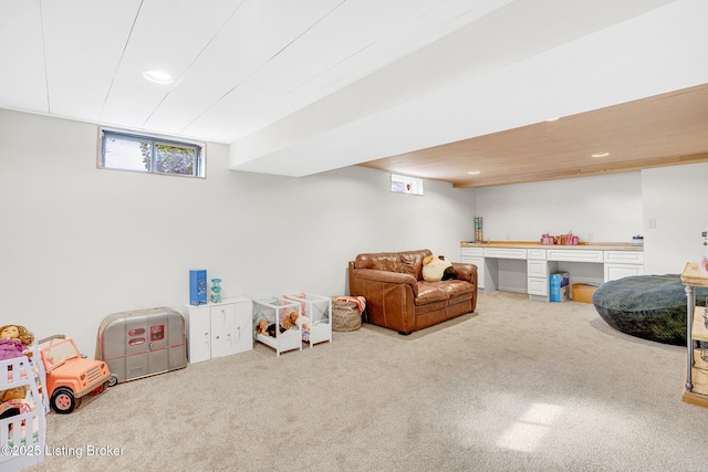 recreation room with carpet floors and a wealth of natural light