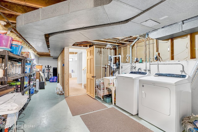 basement with washing machine and clothes dryer