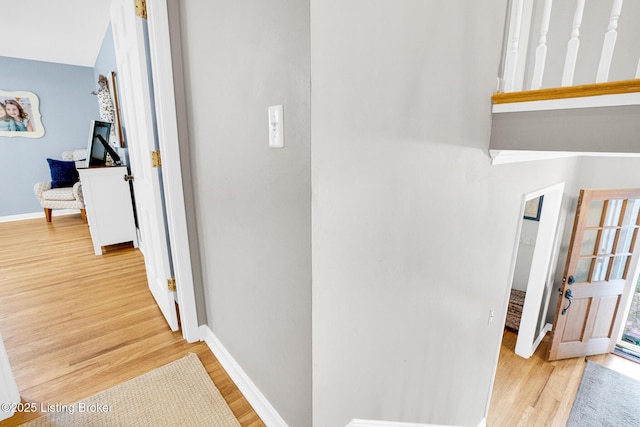 hallway with light wood-type flooring