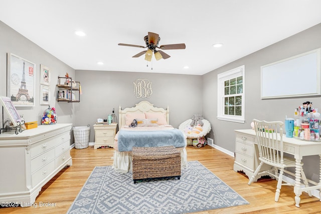 bedroom with ceiling fan and light hardwood / wood-style flooring