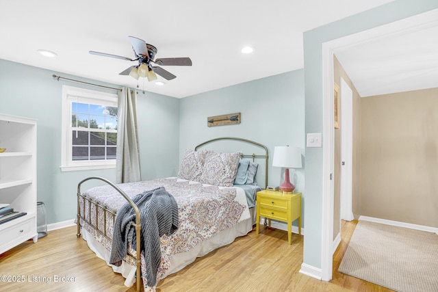 bedroom featuring light wood-type flooring and ceiling fan