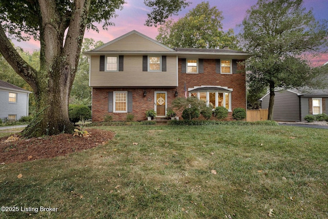 view of front of house with a yard