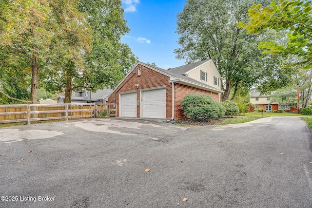 view of side of home featuring a garage