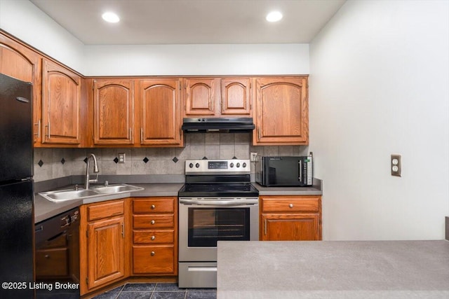 kitchen featuring backsplash, dark tile patterned flooring, sink, and black appliances