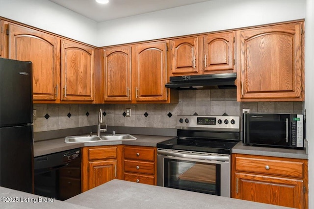 kitchen featuring backsplash, sink, and black appliances