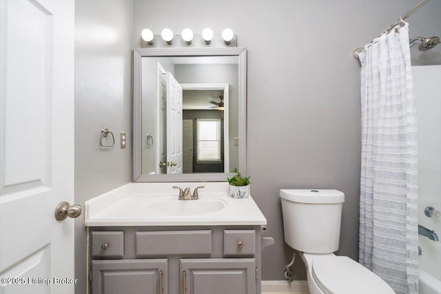 full bathroom featuring shower / tub combo with curtain, vanity, and toilet