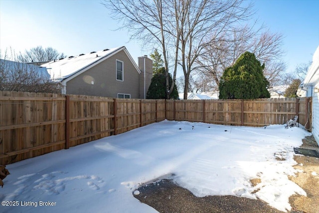 view of yard layered in snow