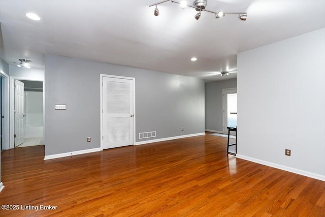 empty room featuring hardwood / wood-style flooring