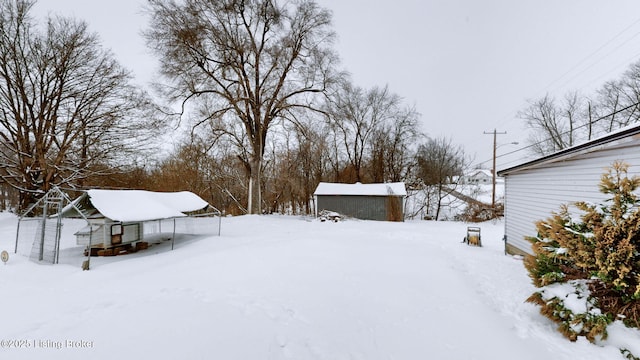 view of yard layered in snow