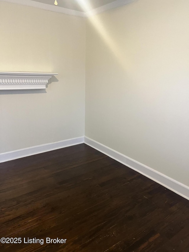 unfurnished room featuring dark hardwood / wood-style flooring