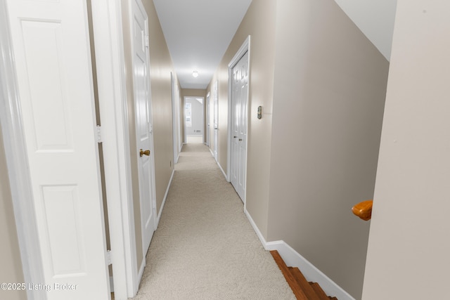 corridor with light colored carpet