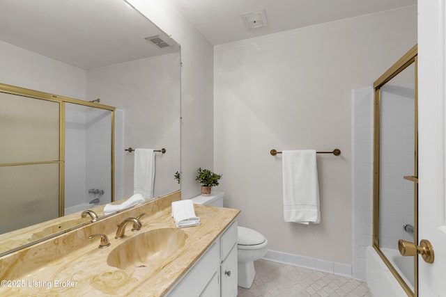 full bathroom with enclosed tub / shower combo, vanity, and toilet