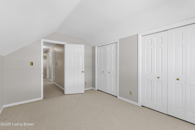 additional living space with lofted ceiling and light colored carpet