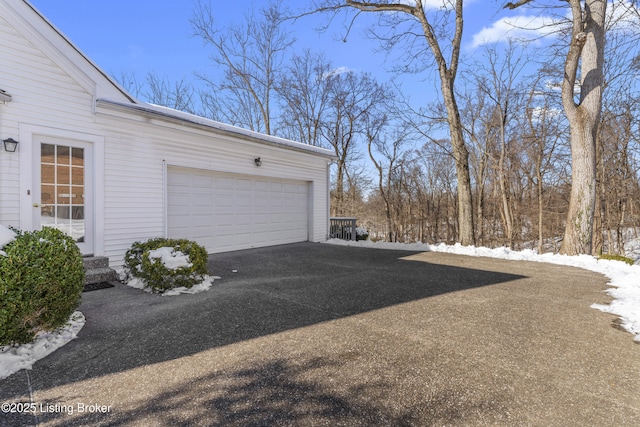 view of snow covered garage