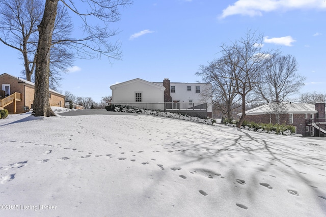 view of snow covered house