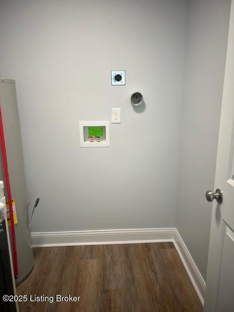 clothes washing area with water heater, dark hardwood / wood-style flooring, hookup for a washing machine, and hookup for an electric dryer