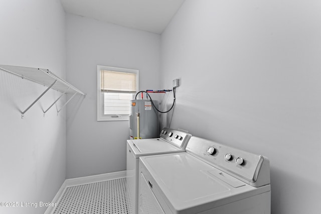 laundry area featuring washer and dryer and electric water heater