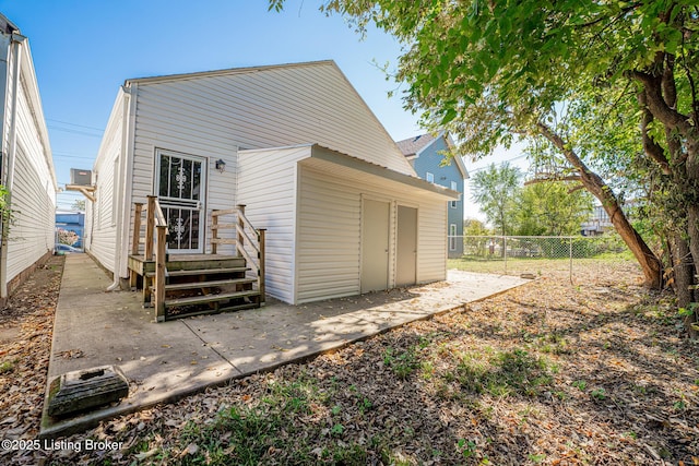 back of house with a patio