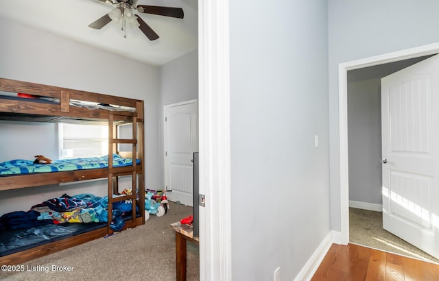 bedroom with ceiling fan and hardwood / wood-style floors