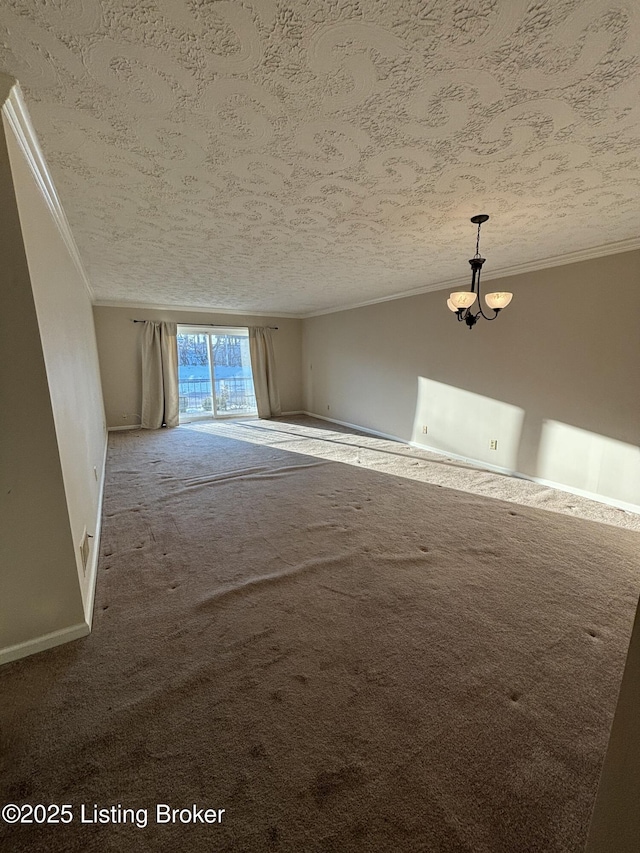 carpeted spare room featuring a textured ceiling and ornamental molding