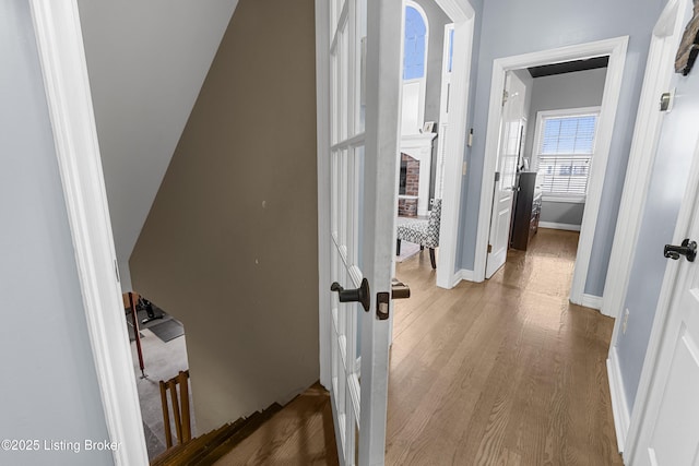 corridor featuring wood-type flooring