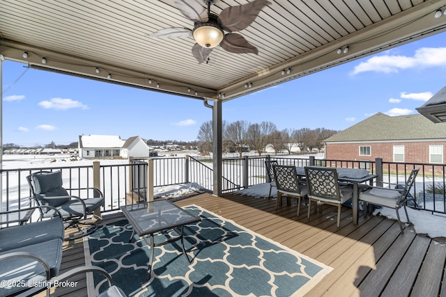 snow covered deck featuring ceiling fan