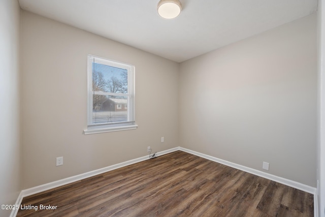 spare room featuring dark hardwood / wood-style floors