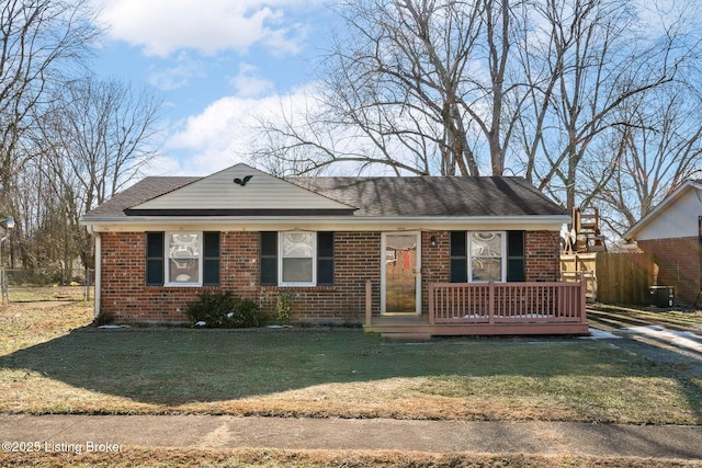 ranch-style home with central AC and a front lawn