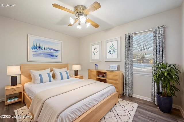 bedroom featuring dark hardwood / wood-style flooring and ceiling fan