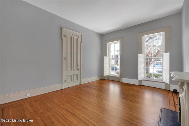 spare room with hardwood / wood-style floors