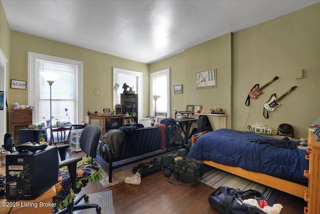 bedroom with hardwood / wood-style flooring