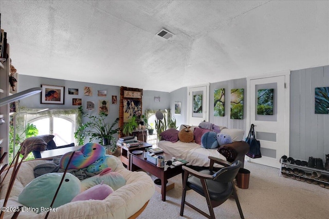 living room with light colored carpet and a textured ceiling