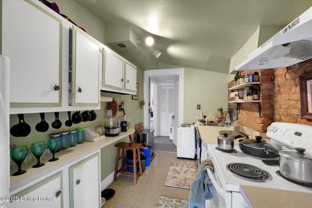 kitchen featuring white cabinetry, lofted ceiling, and white range with electric stovetop