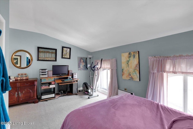 carpeted bedroom with vaulted ceiling