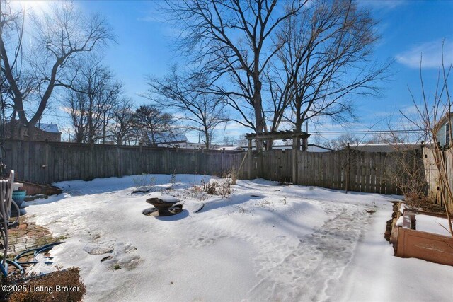 view of yard covered in snow