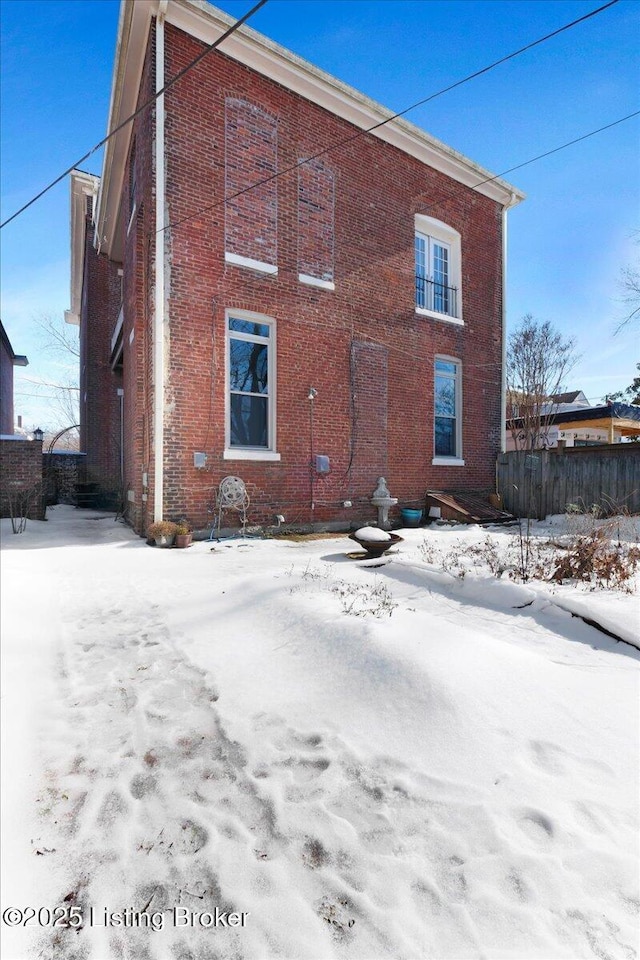 view of snow covered house